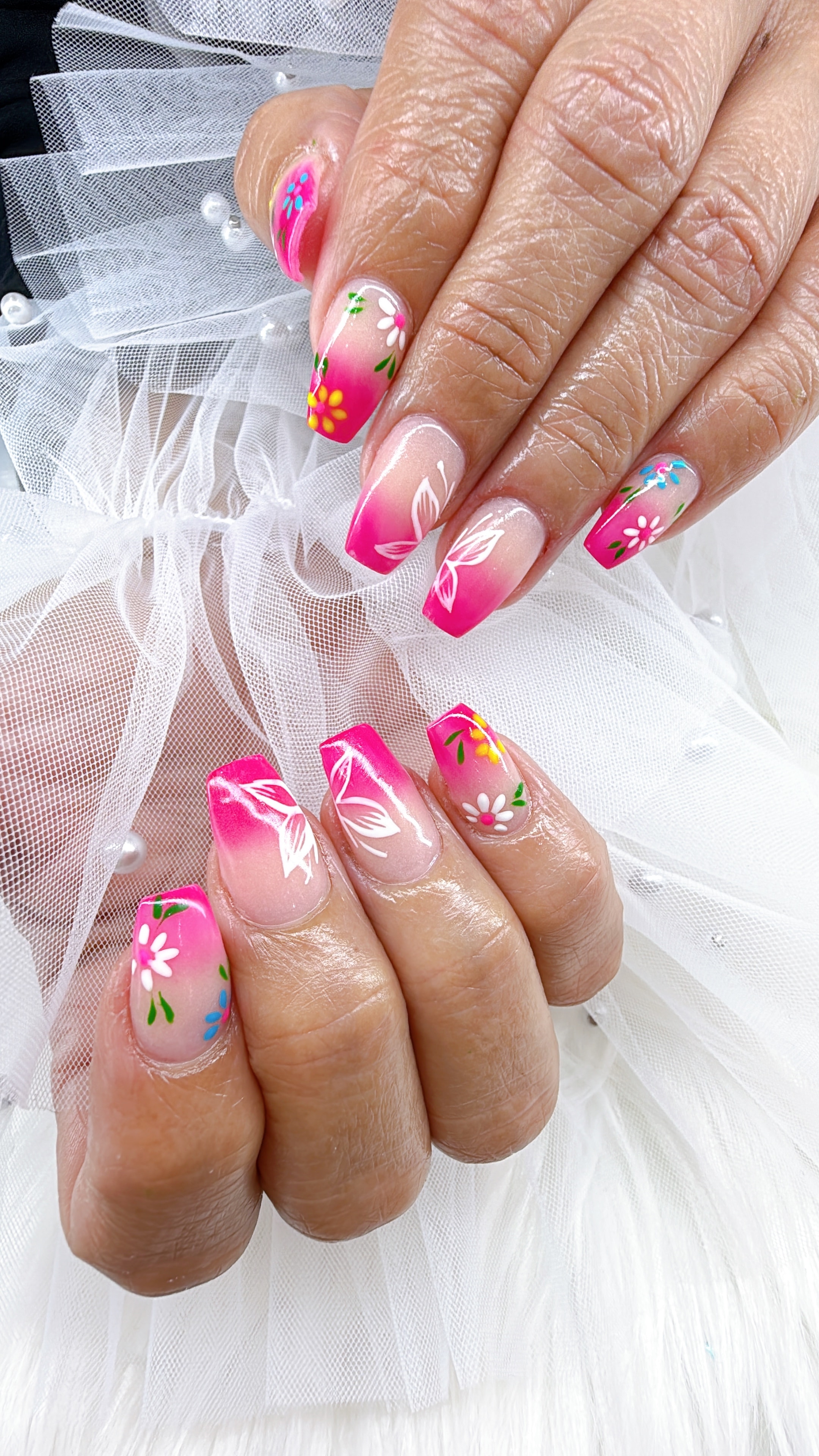 Green nail art with gold glitter and clover designs