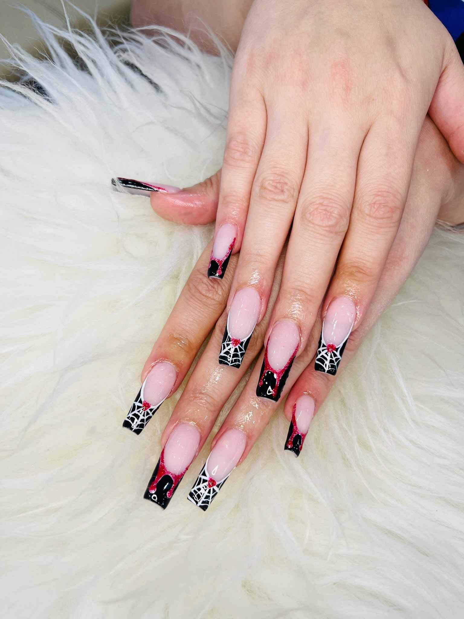 Black and red spider web nail art