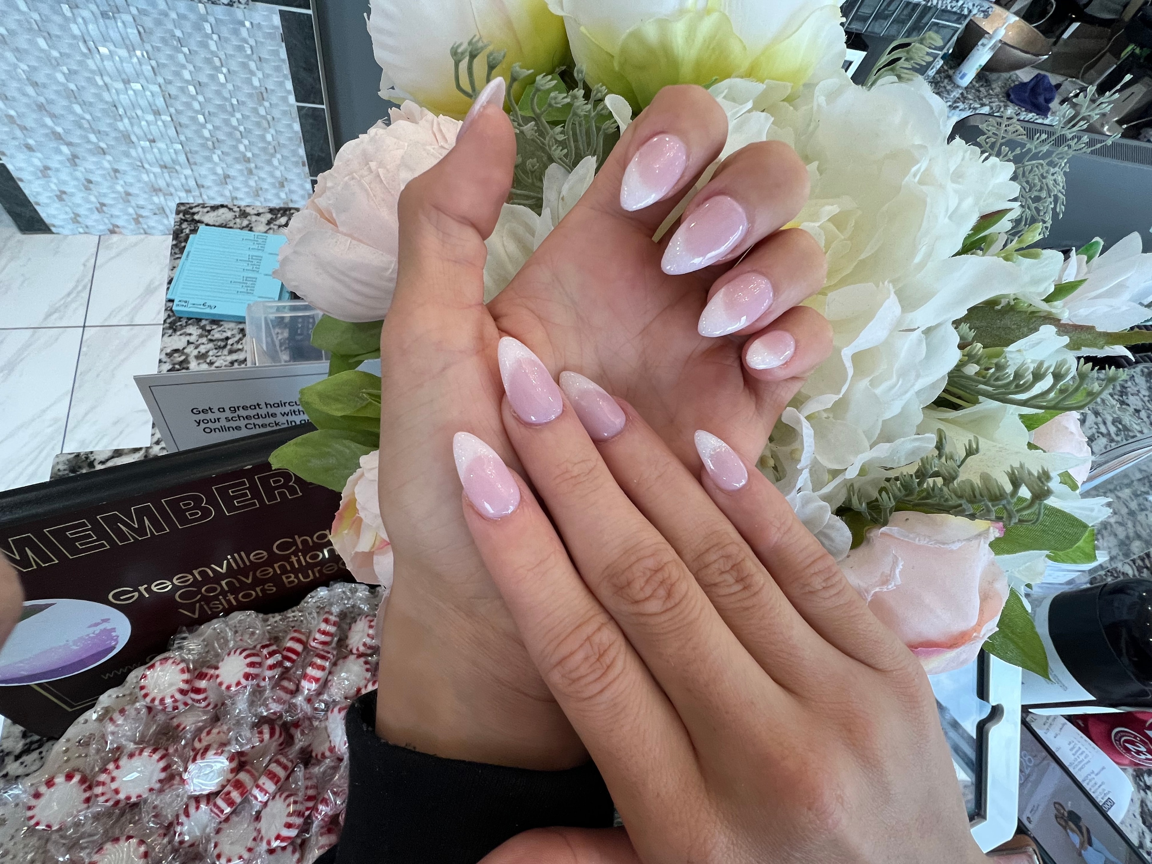 Soft pink ombre almond nails in salon