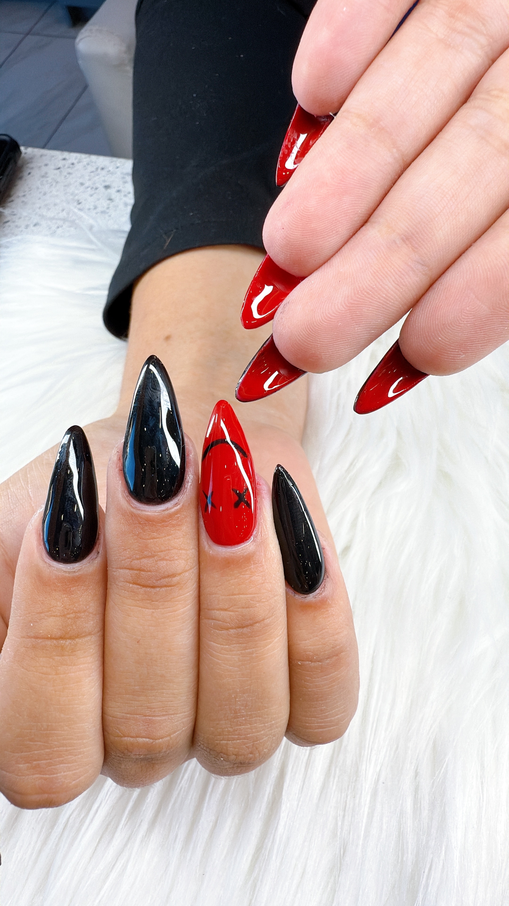 Red and black glossy stiletto nails
