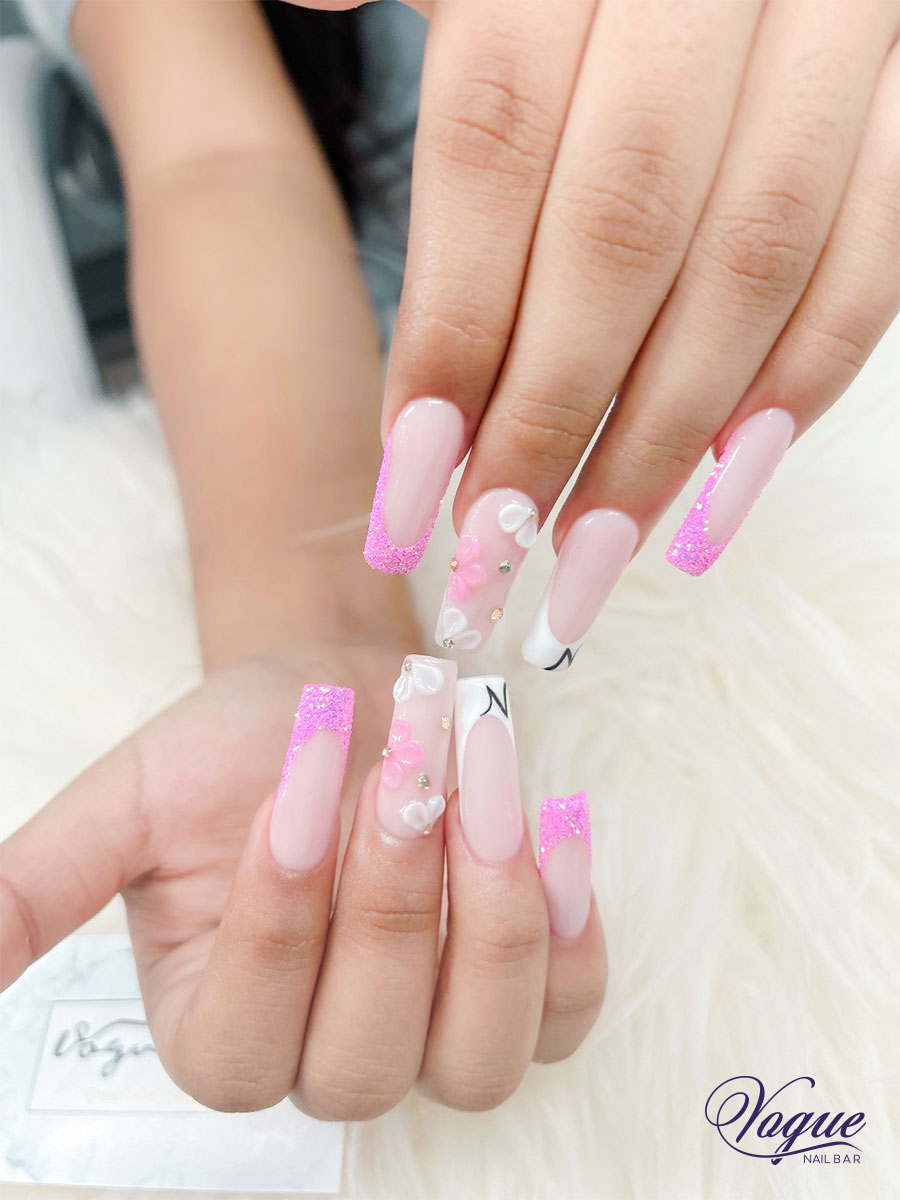 Pink and white ombre nails with rhinestone embellishments